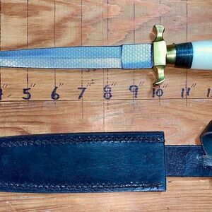 Etched steel dagger with brass guard and pummel comes with black leather sheath